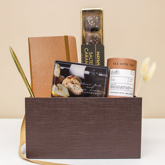 Luxury Gift Box with tea, caramels, crackers a pocket journal and pen.