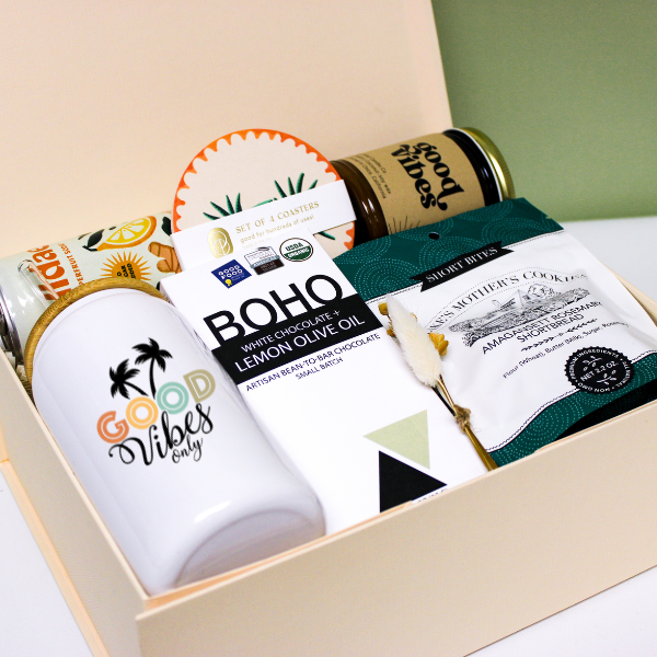 Modern Gift box with 'Good Vibes' mug, chocolate, cookies, drink, candle and coasters.